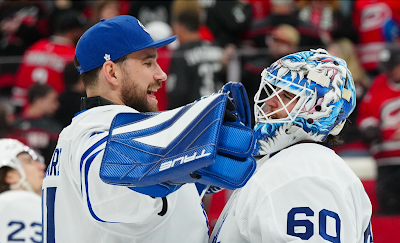 Toronto Maple Leafs goalies Anthony Stolarz and Joseph Woll hug after a win